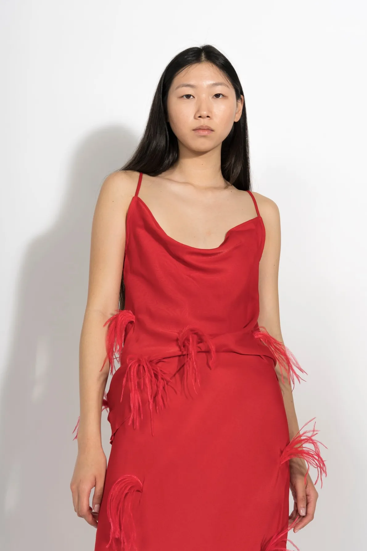RED SLIP TOP WITH FEATHERS
