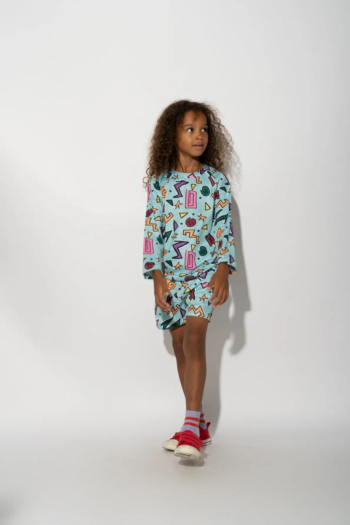 TURQUOISE SQUIGGLE PRINT LONG SLEEVE SWIM TOP